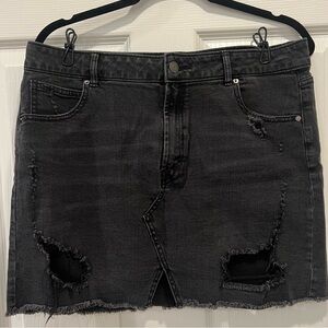 Distressed black jean skirt